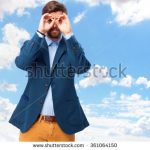 stock-photo-happy-businessman-binoculars-sign-361064150
